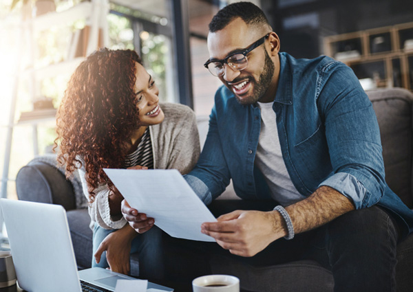 Couple reviewing documents at home